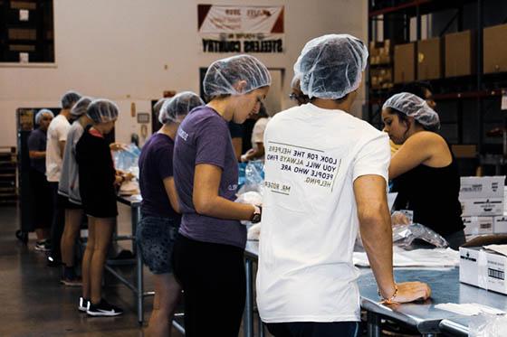 Photo of Chatham University students volunteering at a food bank